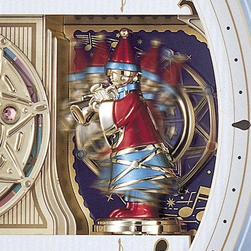 実機の小びとと回転飾り。金色の金属と赤・青・紫の宝石。